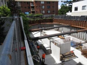 Deep basement close to existing buildings.